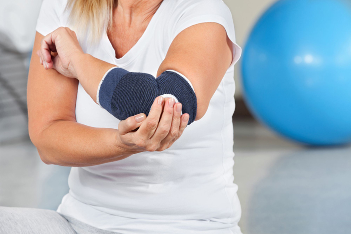 почему болят суставы рук после тренировок
